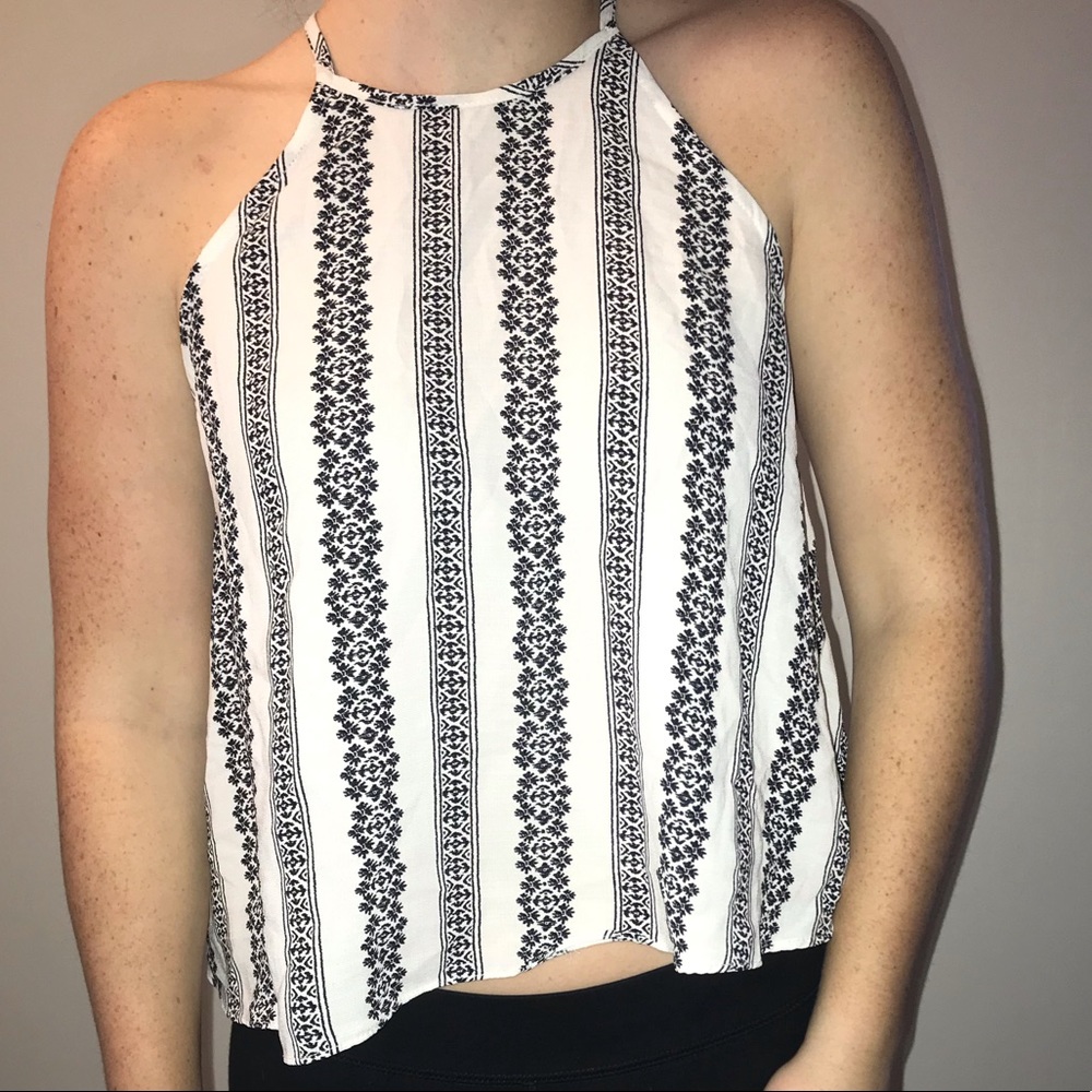 Cute white tank with black floral details.